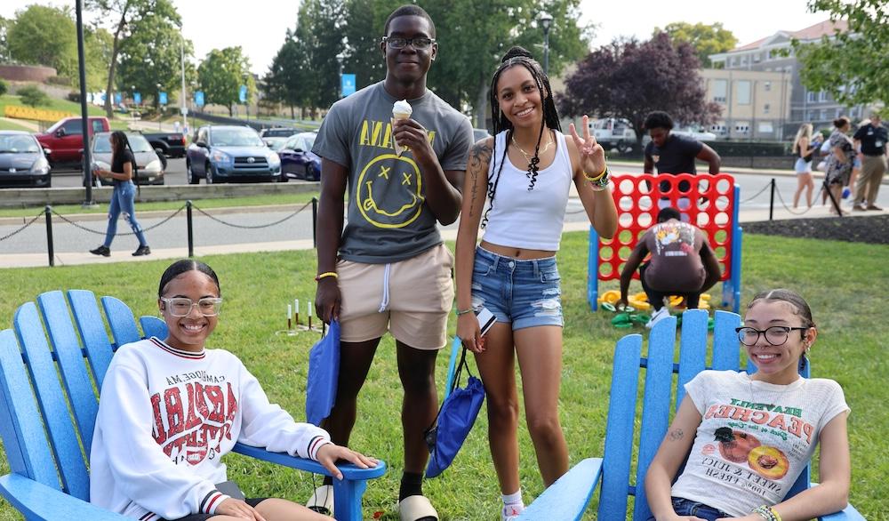 four HFU students hanging out on campus during an orientation event